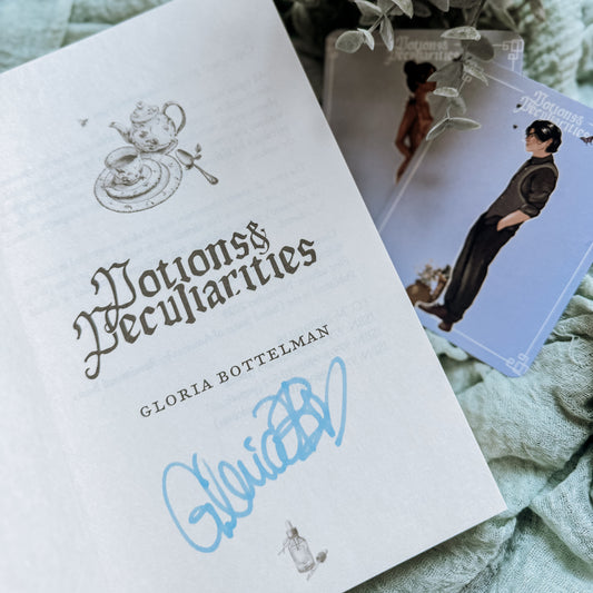 Book titled 'Notions & Peculiarities' by Gloria Bortelman with illustrations on a textured surface.