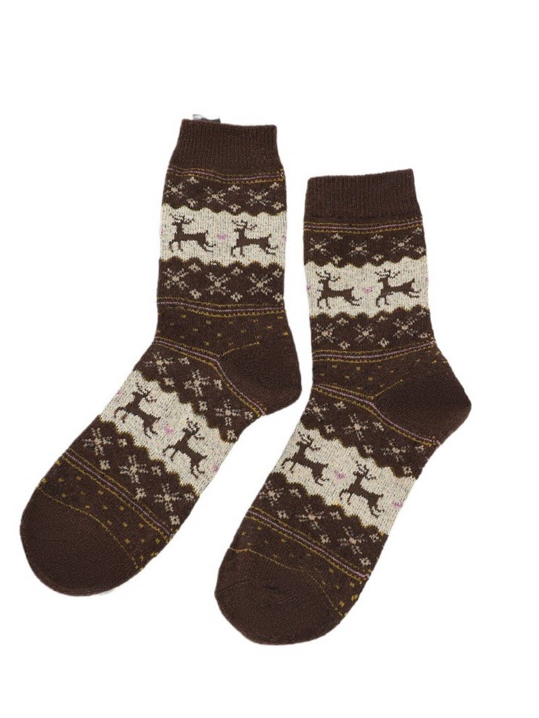 Pair of brown socks with reindeer pattern on a white background