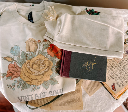 Beige sweatshirt with floral design and 'Vintage Soul' text on a white background