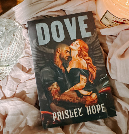 Book titled 'Dove' by Paisley Hope on a textured surface