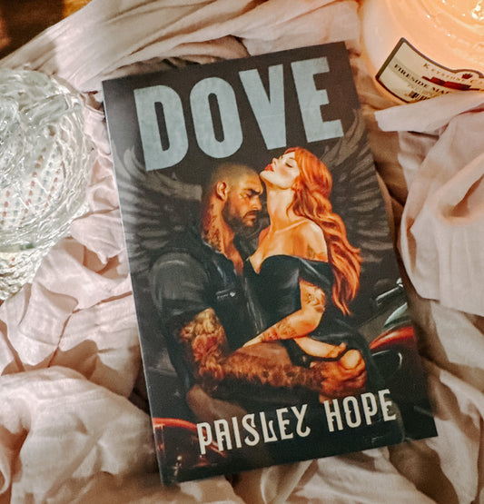 Book titled 'Dove' by Paisley Hope on a textured surface