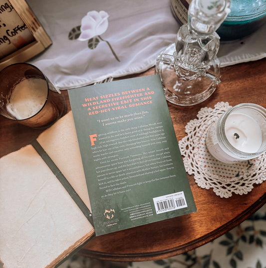 Book titled 'Fight' by Sloane St. James on a table with a bottle and other items.