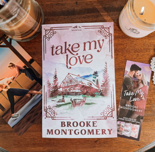 Two books titled 'Take My Love' held in front of a bookshelf.