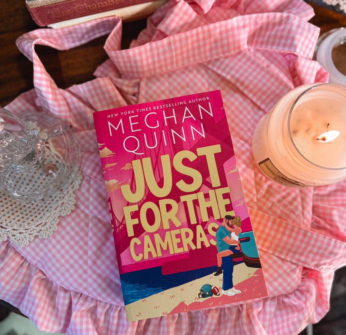 Just for the cameras by Megan Quinn. 