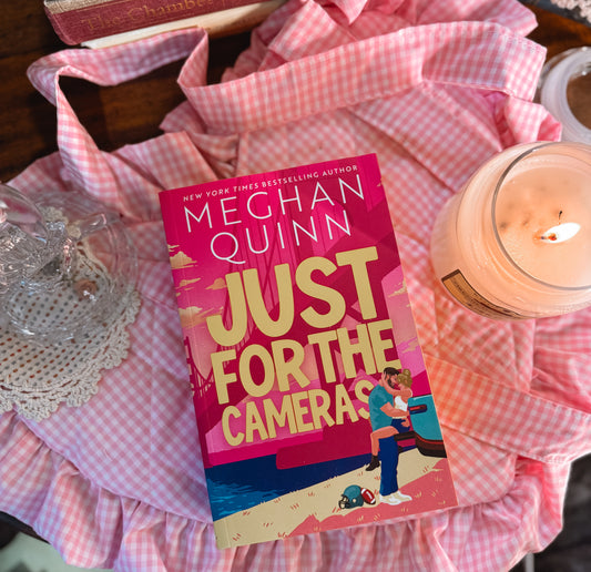 Just for the cameras by Megan Quinn. 