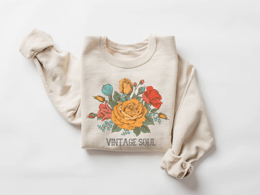 Beige sweatshirt with floral design and 'Vintage Soul' text on a white background