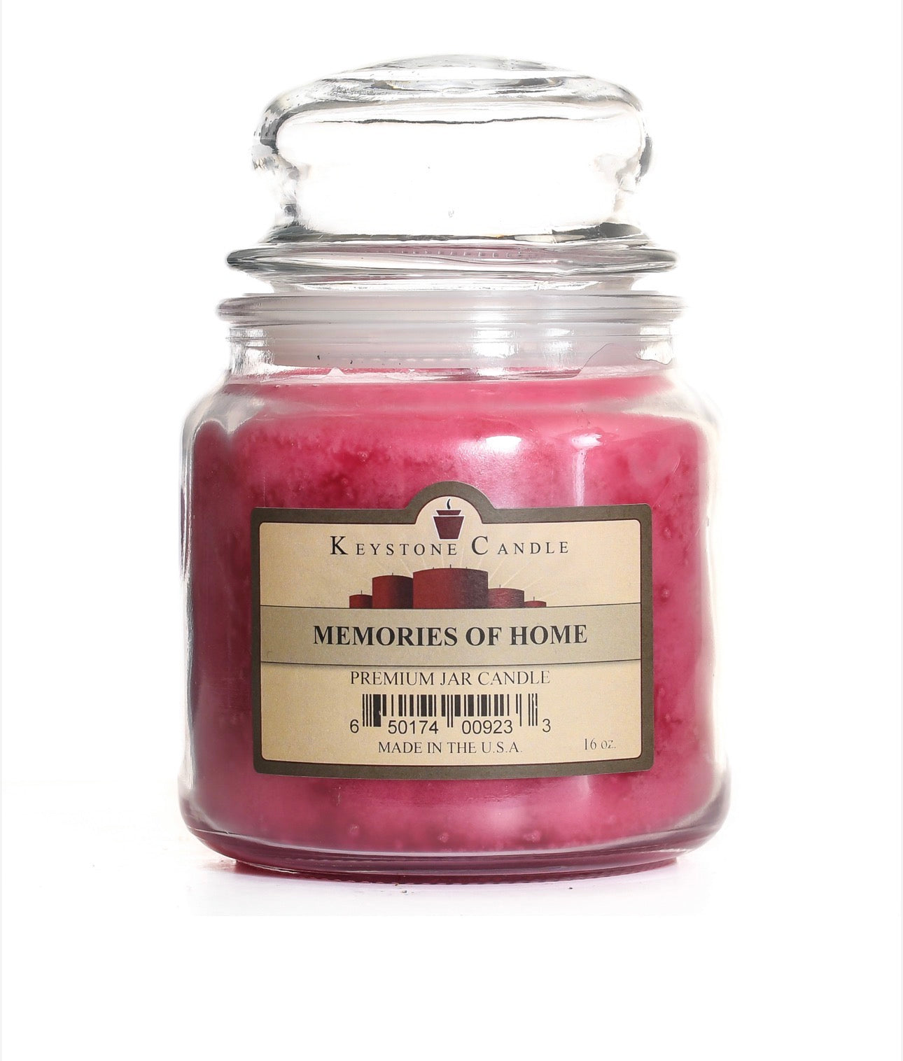 Pink candle in a glass jar labeled 'Memories of Home' by Keystone Candle on a white background.