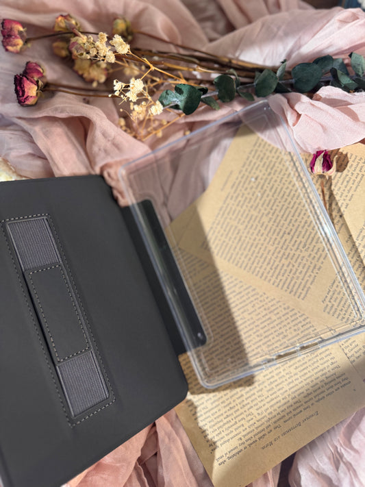 Kindle case  with a unicorn illustration on a surface with flowers and leaves