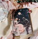 Kindle case  with a romantic illustration of a knight and a lady on a balcony, surrounded by flowers and lace.