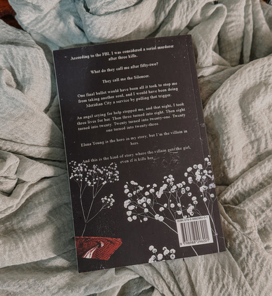 Book titled 'Under Your Scars' by Ariel N. Anderson on a textured surface