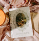 Journal titled 'A Little Book of Thoughts' with decorative cover featuring ducks, placed on a soft pink fabric background.