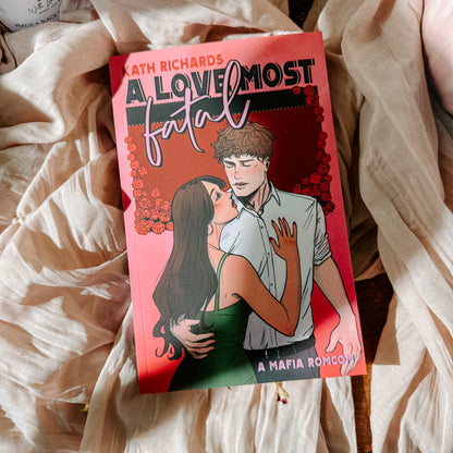 Book titled 'A Love Most Fatal' by Kath Richards on a soft fabric background