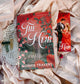 Book titled 'The Heir' by Sophia Travers on a decorative surface with roses.