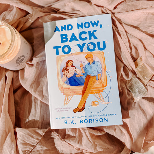 Book titled 'And Now, Back to You' by B.K. Borison on a textured surface with a cup.
