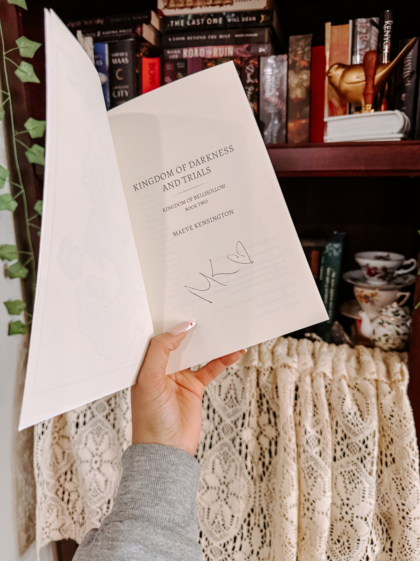 Kingdom of Darkness and Trials By: Maeve Kensington
SIGNED