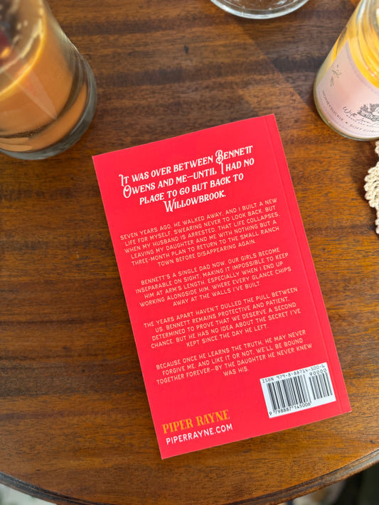 Book titled 'Chasing Love' by Piper Rayne on a wooden surface with a cup of coffee.