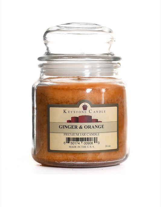 Jar candle labeled 'Ginger & Orange' by Keystone Candle on a white background