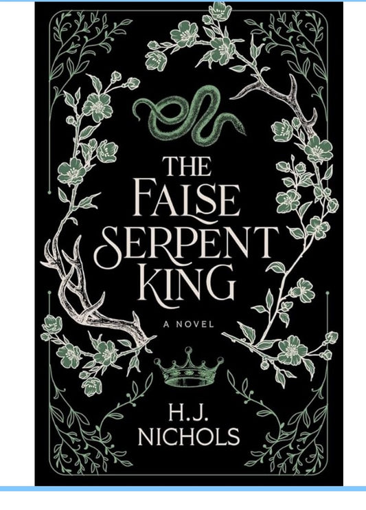 Book titled 'The False Serpent King' by H.J. Nichols on a soft fabric background