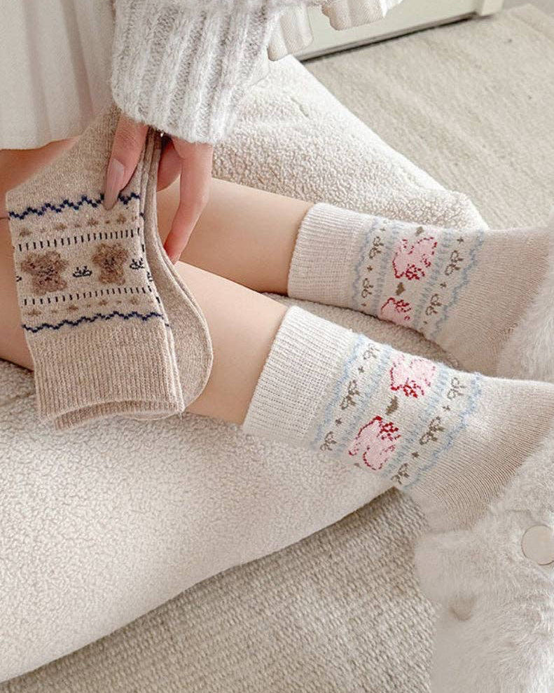 Person wearing patterned socks with a neutral background