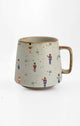 Ceramic mug with nutcracker design on a white background